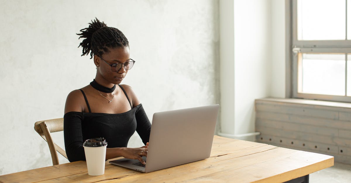 Is it dangerous to go to Île de Noirmoutier using the pass? - Concentrated African American female freelancer in casual clothes and eyeglasses sitting at table with cup of coffee near window and typing on netbook while looking at screen Is it dangerous to go to Île de Noirmoutier using the pass? - Concentrated African American female freelancer in casual clothes and eyeglasses sitting at table with cup of coffee near window and typing on netbook while looking at screen