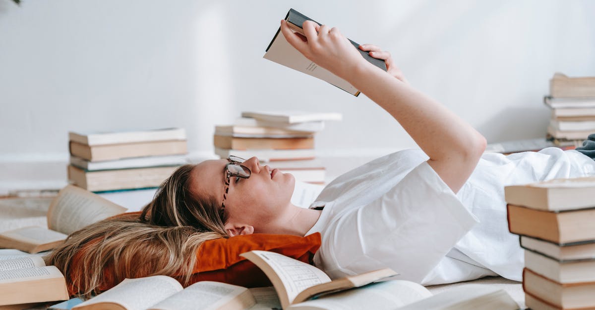 Is it difficult to get study permit for Canada after a long academic gaps in between? [closed] - Young smart woman reading book on floor