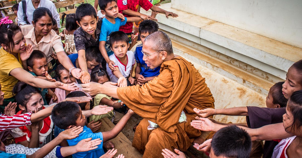 Is it generally true that Japanese people are more reluctant to help Asian compared to Western foreigners? [closed] - Monk Surrounded by Children