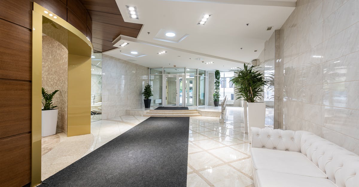 Is it illegal to enter a hotel floor (corridor) as a non guest? - Interior of contemporary spacious lobby without people with white leather sofa and long black carpet Is it illegal to enter a hotel floor (corridor) as a non guest? - Interior of contemporary spacious lobby without people with white leather sofa and long black carpet