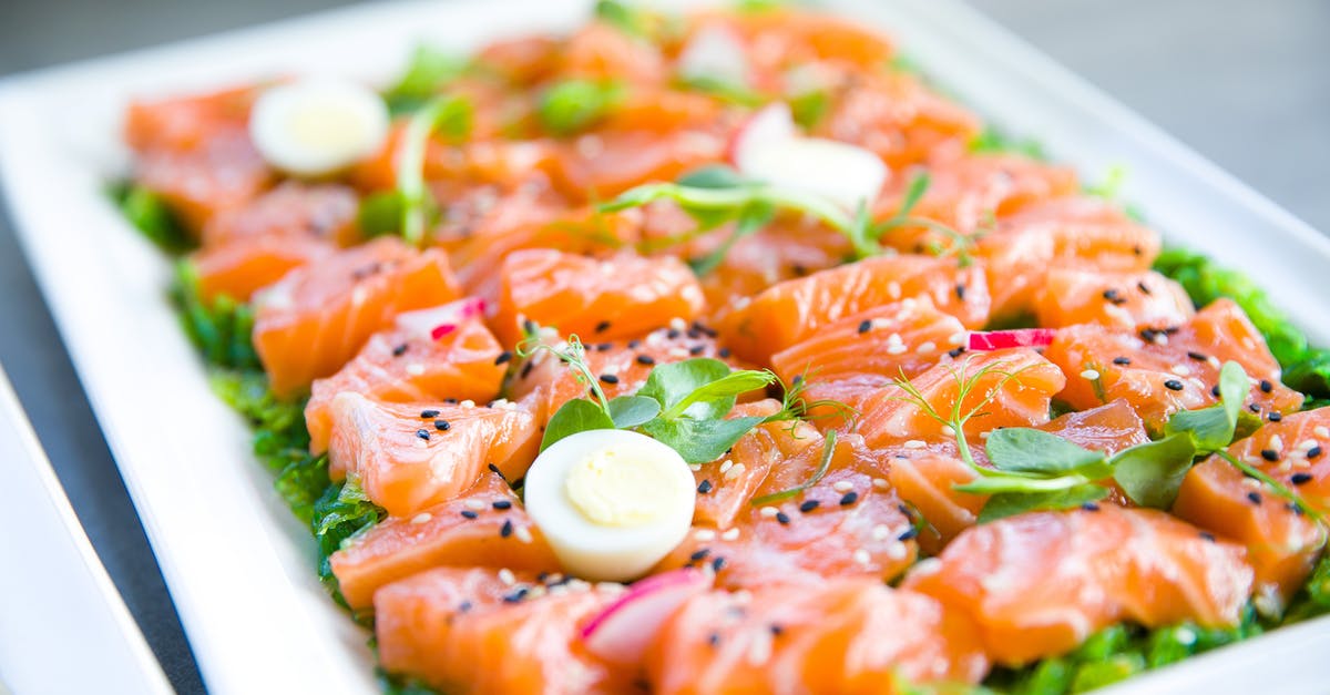 Is it illegal to serve baby seafood in Italy? [closed] - Salmon with greens and quail eggs on banquet table