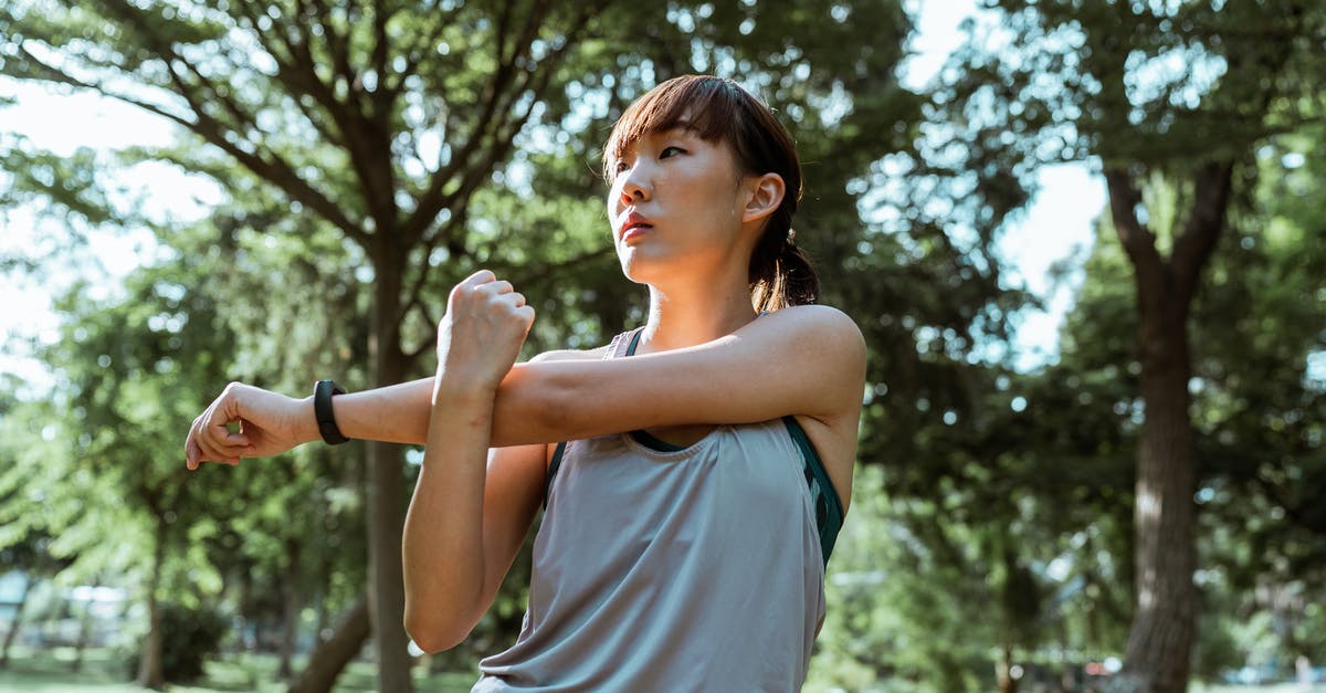 Is it legal to bring back seashells from Ireland - From below of serious Asian female athlete in sportswear stretching arms and back muscles while doing exercises in park Is it legal to bring back seashells from Ireland - From below of serious Asian female athlete in sportswear stretching arms and back muscles while doing exercises in park