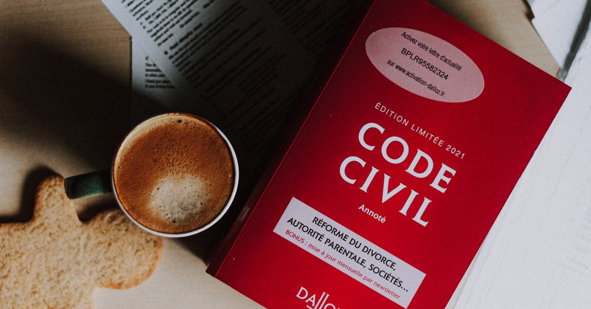 Is it legal to study while on a tourist Schengen visa? - Cup of cappuccino and cookie placed near book on desk