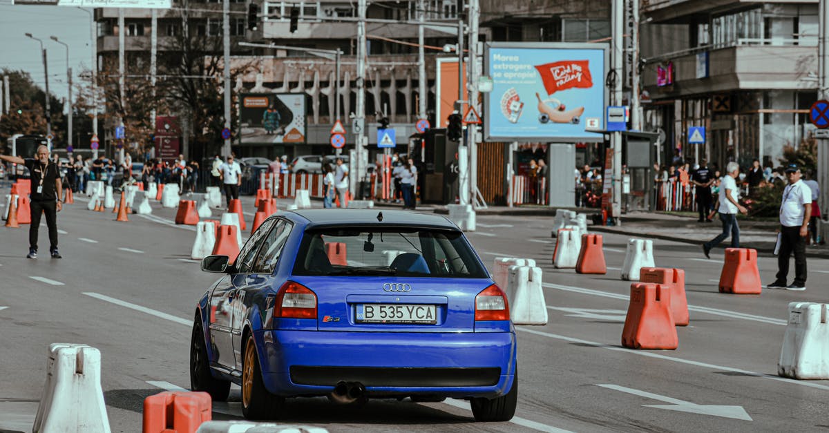 Is it legal to turn high beams on when driving on a European highway with fully separated lanes? - Racing car on busy street Is it legal to turn high beams on when driving on a European highway with fully separated lanes? - Racing car on busy street