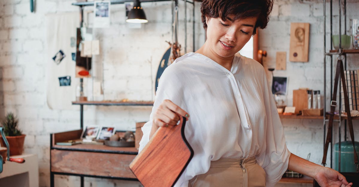 Is it mandatory to show the boarding pass at a duty free shop in the UK? - Young content ethnic female shopper with wooden cutting board in store with brick wall Is it mandatory to show the boarding pass at a duty free shop in the UK? - Young content ethnic female shopper with wooden cutting board in store with brick wall