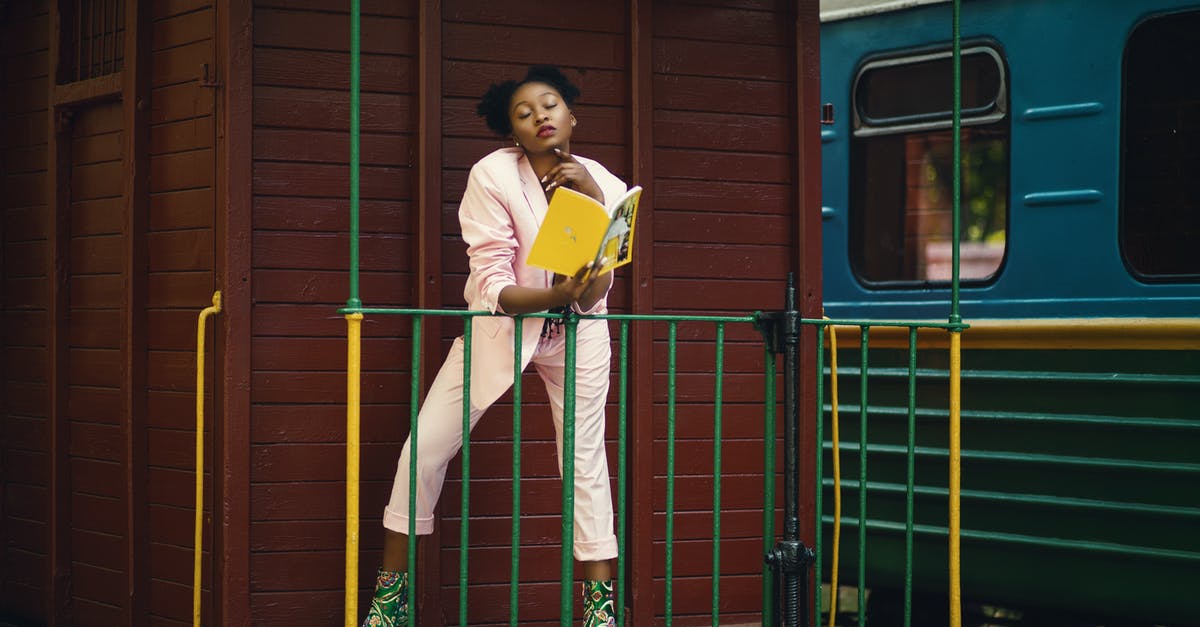 Is it necessary to book trains in the Jungfrau region? - Woman Wearing Pink Blazer, Pants and Green Heeled Shoes Holding Yellow Covered Book Is it necessary to book trains in the Jungfrau region? - Woman Wearing Pink Blazer, Pants and Green Heeled Shoes Holding Yellow Covered Book