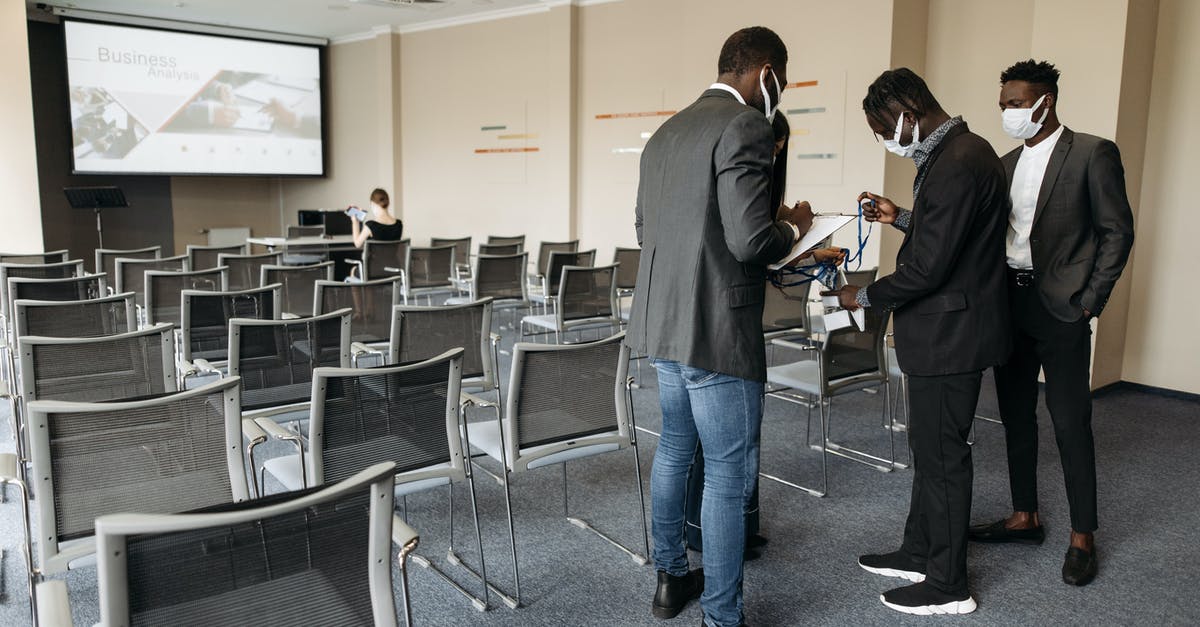 Is it normal to be stopped by authorities and asked for ID in Paris? [closed] - People inside a Conference Room Wearing Face Masks
