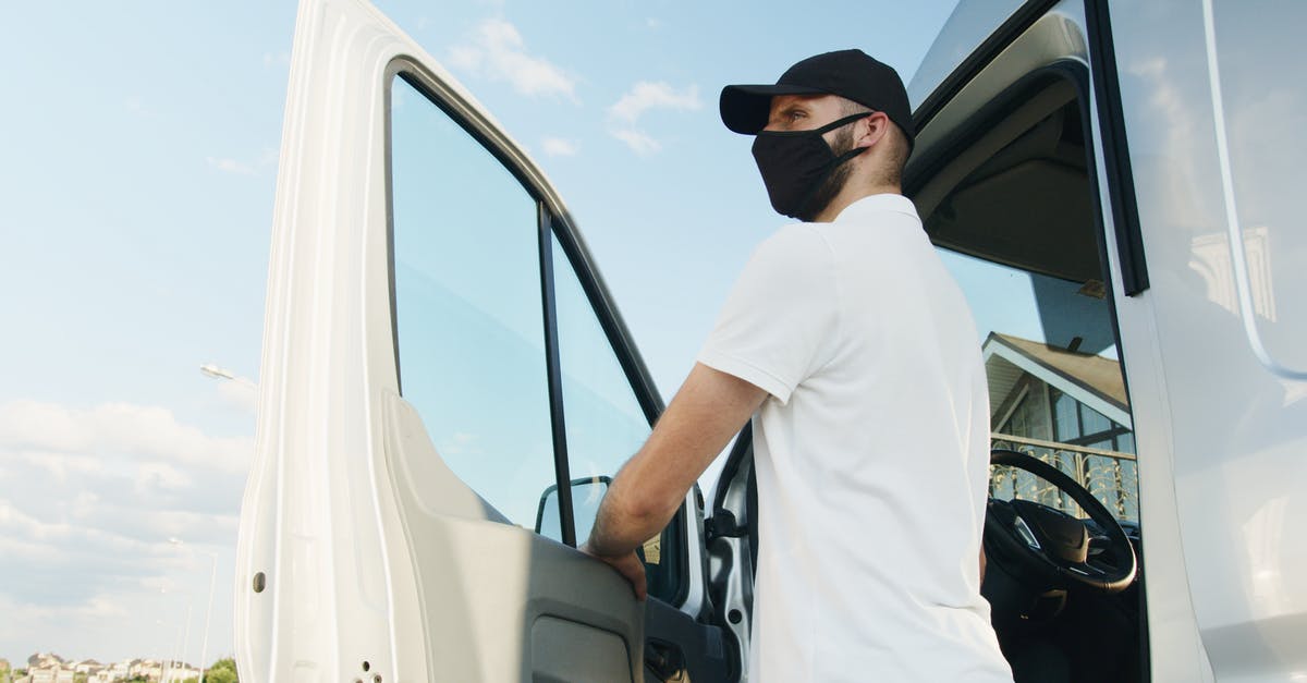 Is it normal to tip an Uber driver in Canada? - Man in White Polo Shirt Standing by the Vehicle Door Is it normal to tip an Uber driver in Canada? - Man in White Polo Shirt Standing by the Vehicle Door