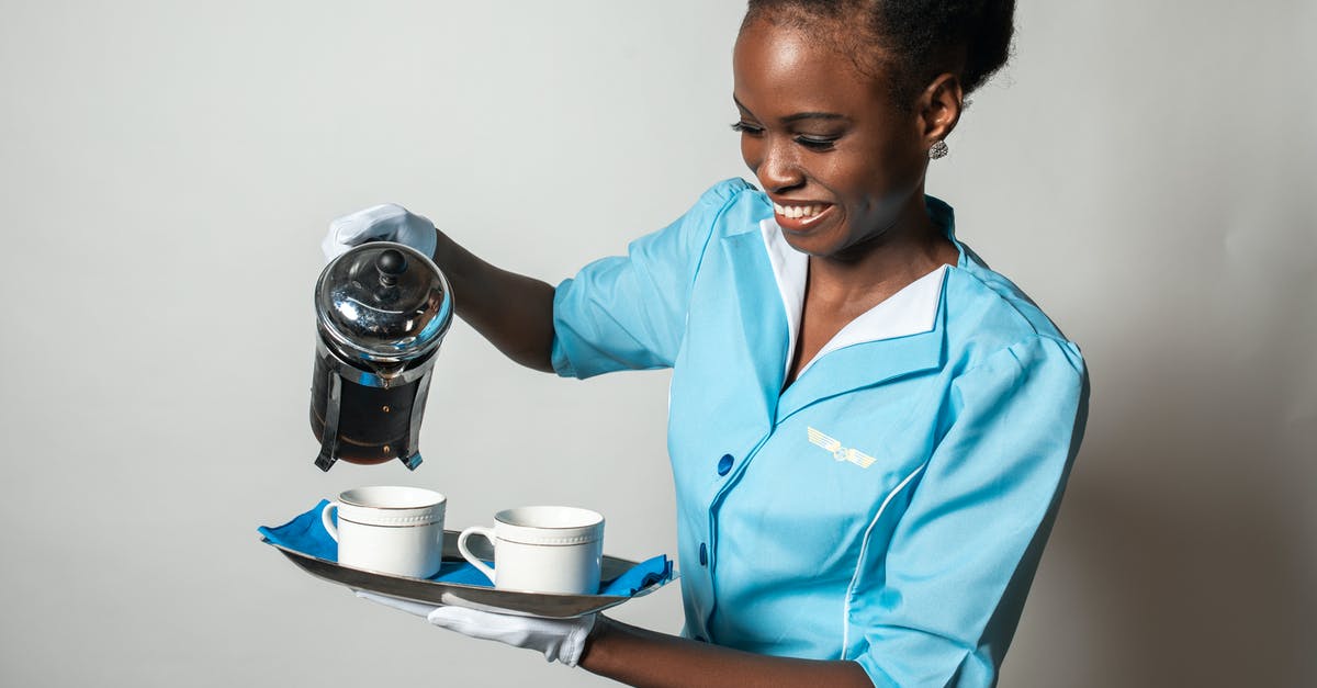 Is it OK to dress as a stewardess on a flight? - Woman Pouring Coffee in a Cup Is it OK to dress as a stewardess on a flight? - Woman Pouring Coffee in a Cup