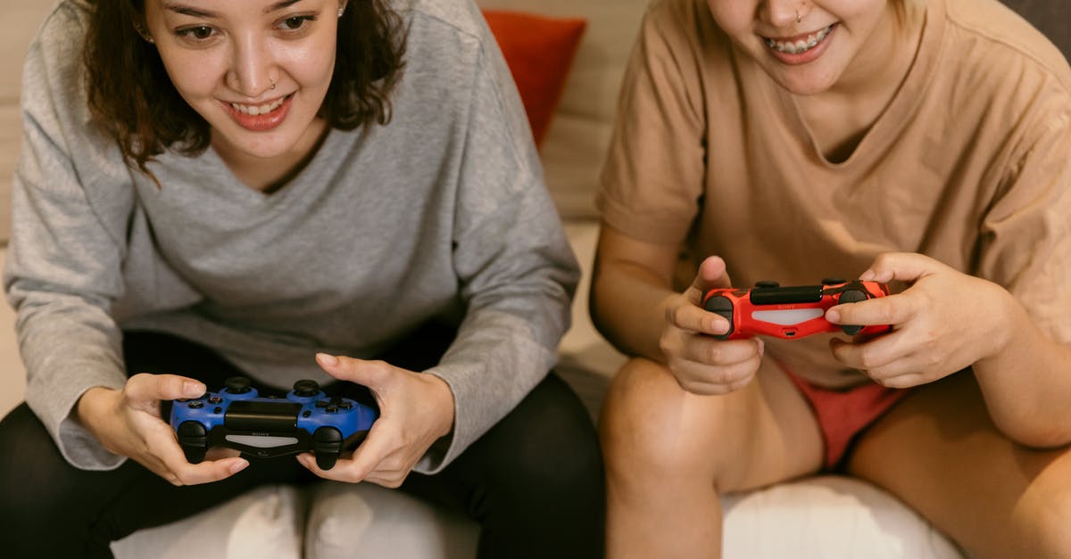 Is it ok to provide match tickets from third party sites - Crop Asian girlfriends playing video games at home Is it ok to provide match tickets from third party sites - Crop Asian girlfriends playing video games at home
