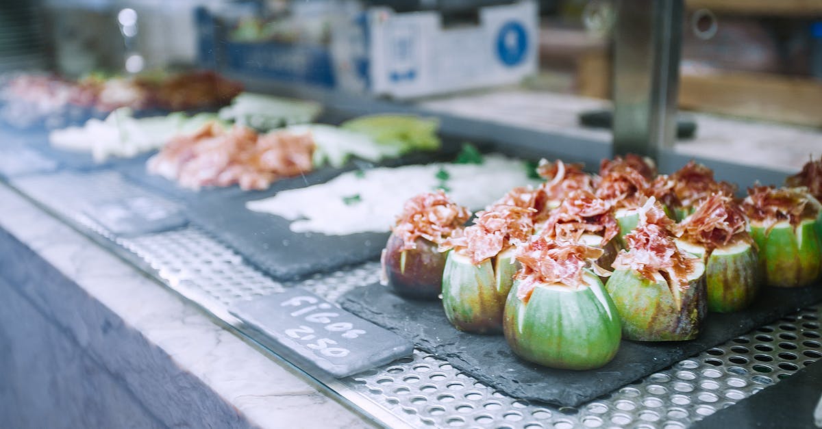 Is it okay to mix in local language when I know it poorly? - Delicious exotic stuffed figs served on counter in market Is it okay to mix in local language when I know it poorly? - Delicious exotic stuffed figs served on counter in market