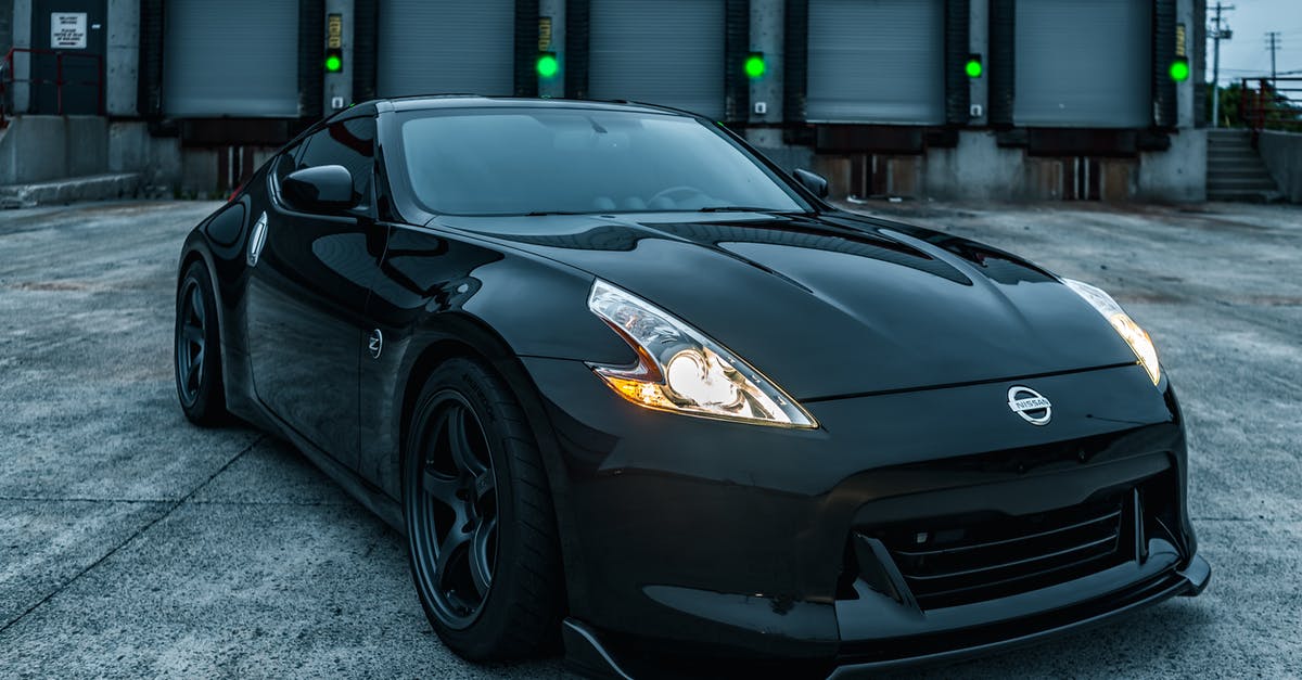 Is it possible for Indian citizen to visit Australia on tourist visa and buy new car and drive from Adelaide to cairns? - Stylish shiny black sports car with tuning and glowing headlights parked on loading zone