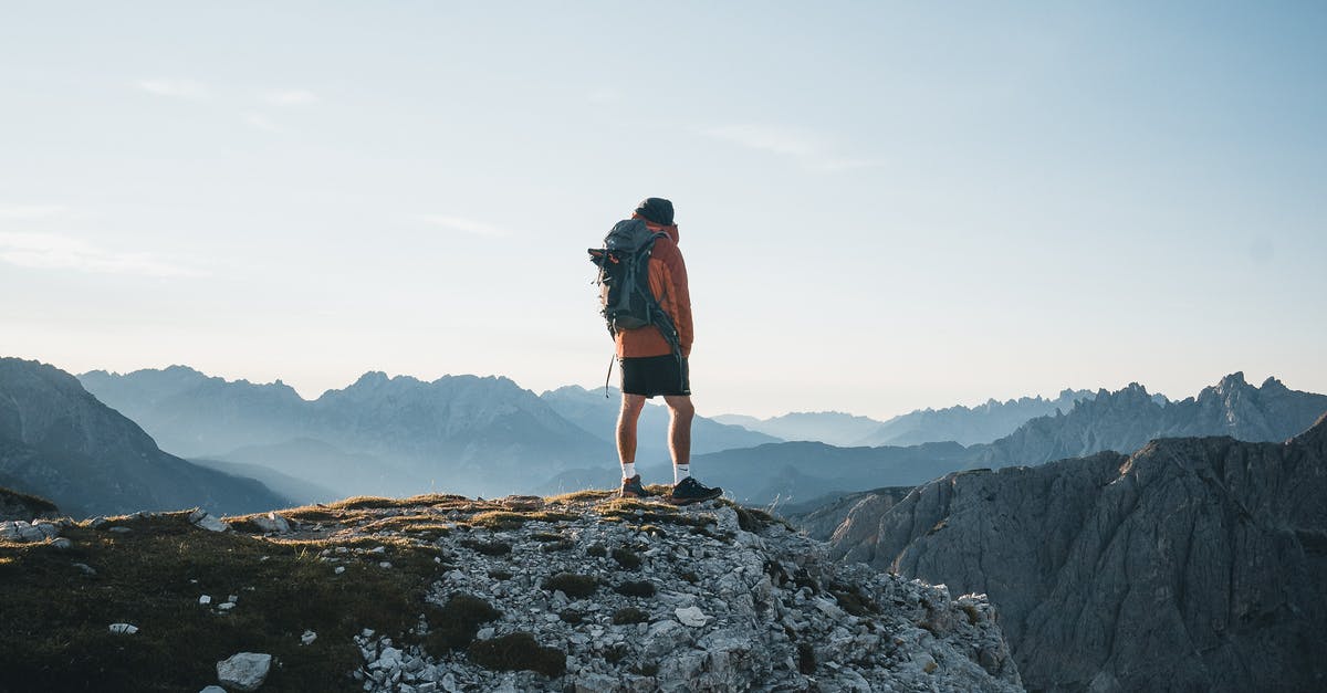 Is it possible to achieve 4G/LTE environment without buying local SIM? - Back view anonymous male explorer with backpack standing on rough mountain peak and enjoying breathtaking scenery of severe highland on clear day Is it possible to achieve 4G/LTE environment without buying local SIM? - Back view anonymous male explorer with backpack standing on rough mountain peak and enjoying breathtaking scenery of severe highland on clear day