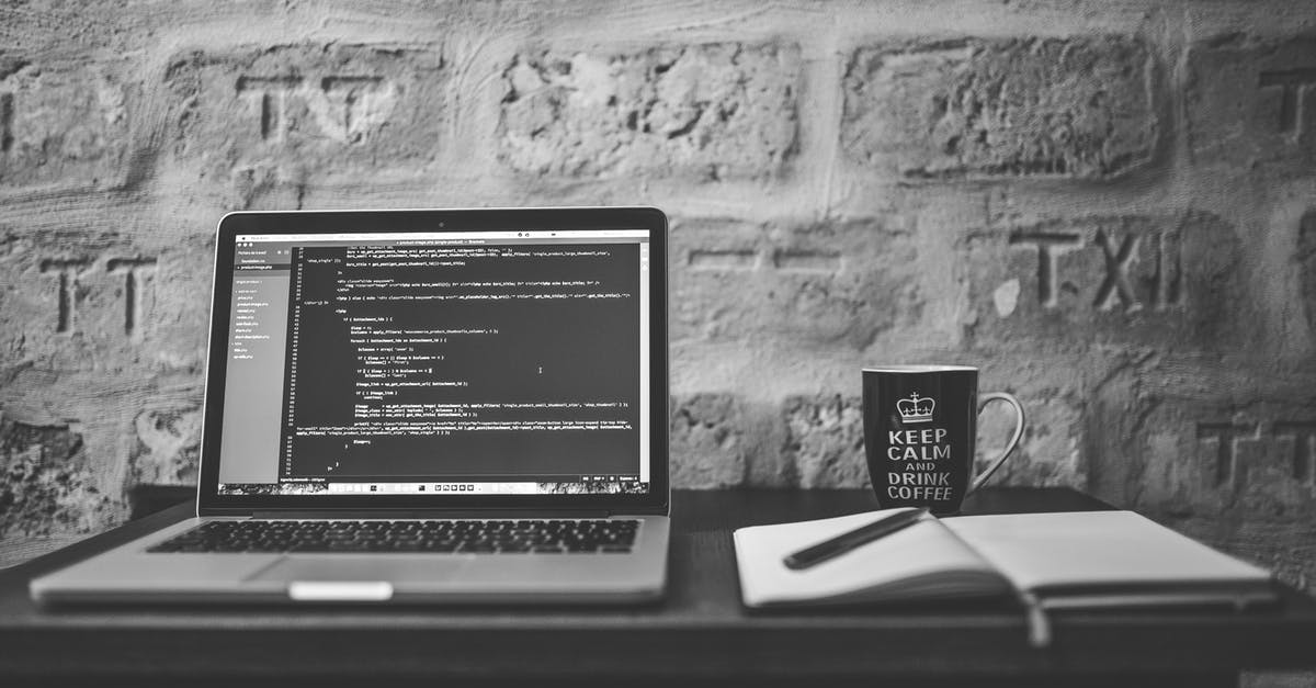 Is it possible to attend coding bootcamps or trainings while travelling? - Grayscale Photo of Computer Laptop Near White Notebook and Ceramic Mug on Table