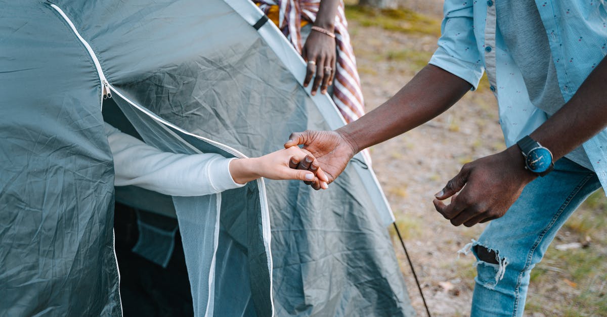 Is it possible to camp in a tent in Finland - Man in Blue T-shirt Holding Persons Hand Is it possible to camp in a tent in Finland - Man in Blue T-shirt Holding Persons Hand