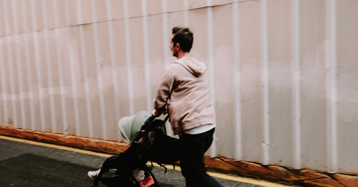 Is it possible to check-in a double stroller on a flight? - Man in Hoodie Sweater Pushing a Stroller Is it possible to check-in a double stroller on a flight? - Man in Hoodie Sweater Pushing a Stroller