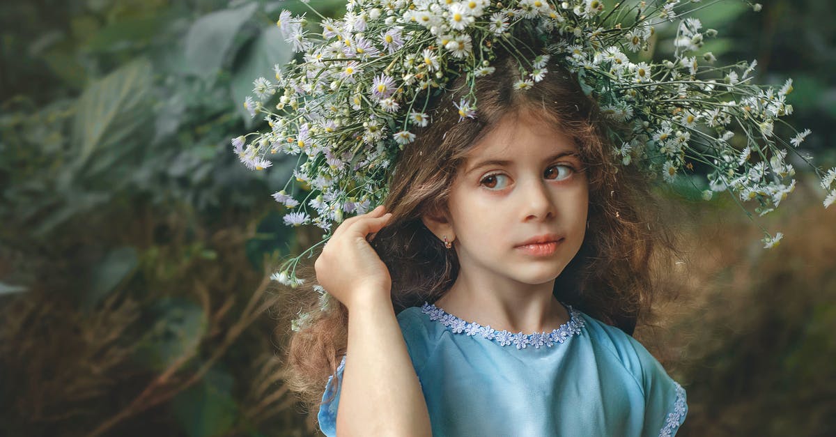 Is it possible to enter the UK with a child on an Accompanied visa and then leave alone? [duplicate] - Thoughtful girl with chaplet standing near greenery