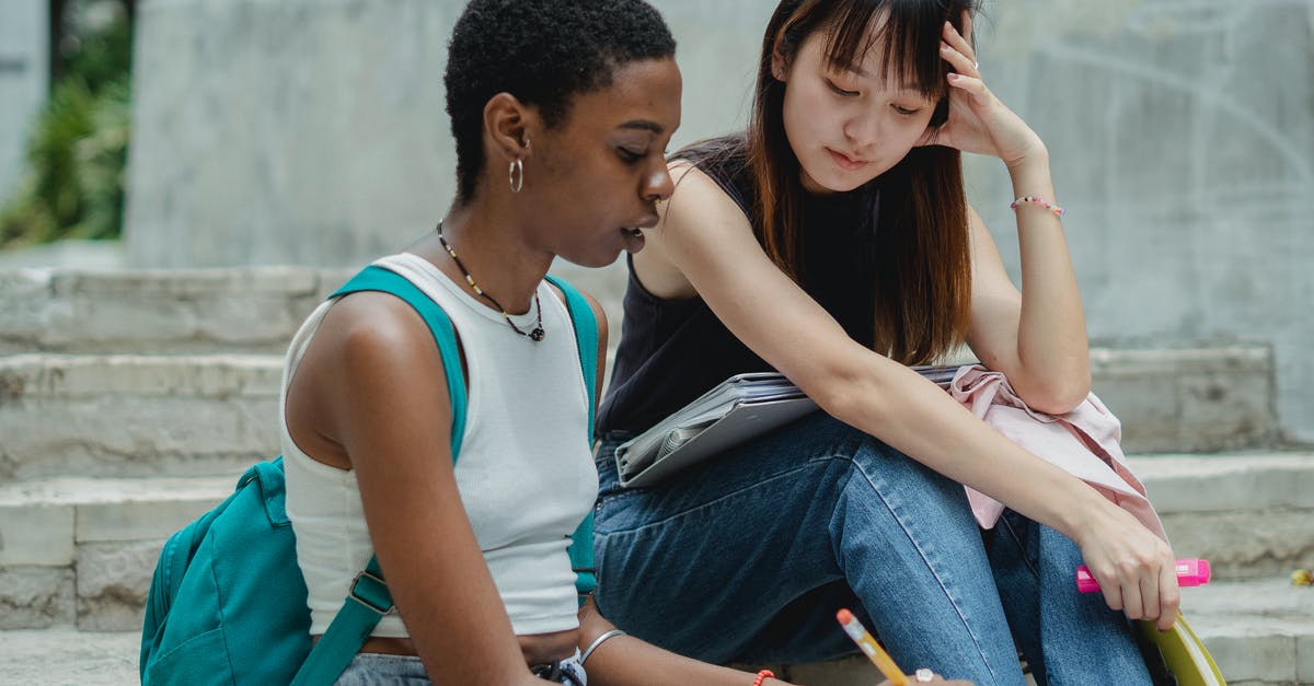 Is it possible to get a Canadian visa without concrete plans? - Thoughtful diverse female students on staircase Is it possible to get a Canadian visa without concrete plans? - Thoughtful diverse female students on staircase