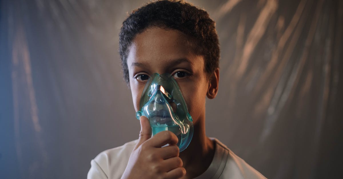 Is it possible to manually release an oxygen mask on airplanes? - A Boy in White Shirt Holding Green Oxygen Mask Is it possible to manually release an oxygen mask on airplanes? - A Boy in White Shirt Holding Green Oxygen Mask