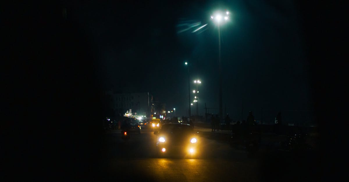 Is it possible to move between the various fifth bases of Fuji? - Through windshield glass of various cars with glowing headlights driving on asphalt road in city against dark night sky Is it possible to move between the various fifth bases of Fuji? - Through windshield glass of various cars with glowing headlights driving on asphalt road in city against dark night sky