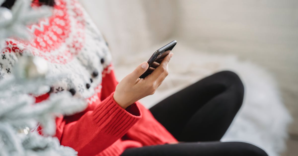 Is it possible to obtain a HES (Hayat Eve Sigar) code without a Turkish phone number? - Crop anonymous female in cozy soft sweater browsing modern mobile phone while sitting near white decorated Christmas tree Is it possible to obtain a HES (Hayat Eve Sigar) code without a Turkish phone number? - Crop anonymous female in cozy soft sweater browsing modern mobile phone while sitting near white decorated Christmas tree