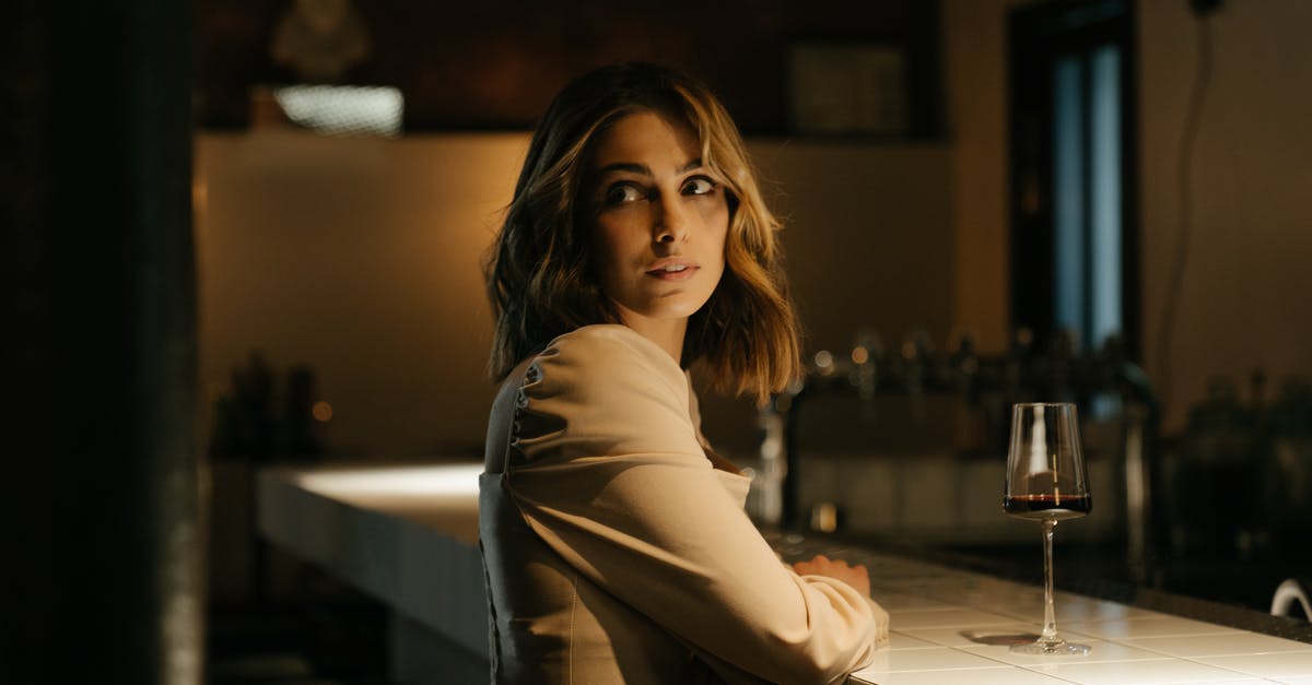 Is it possible to order airag at bars in Mongolia? - Woman in Gray Long Sleeve Shirt Sitting on Bar Seat Is it possible to order airag at bars in Mongolia? - Woman in Gray Long Sleeve Shirt Sitting on Bar Seat