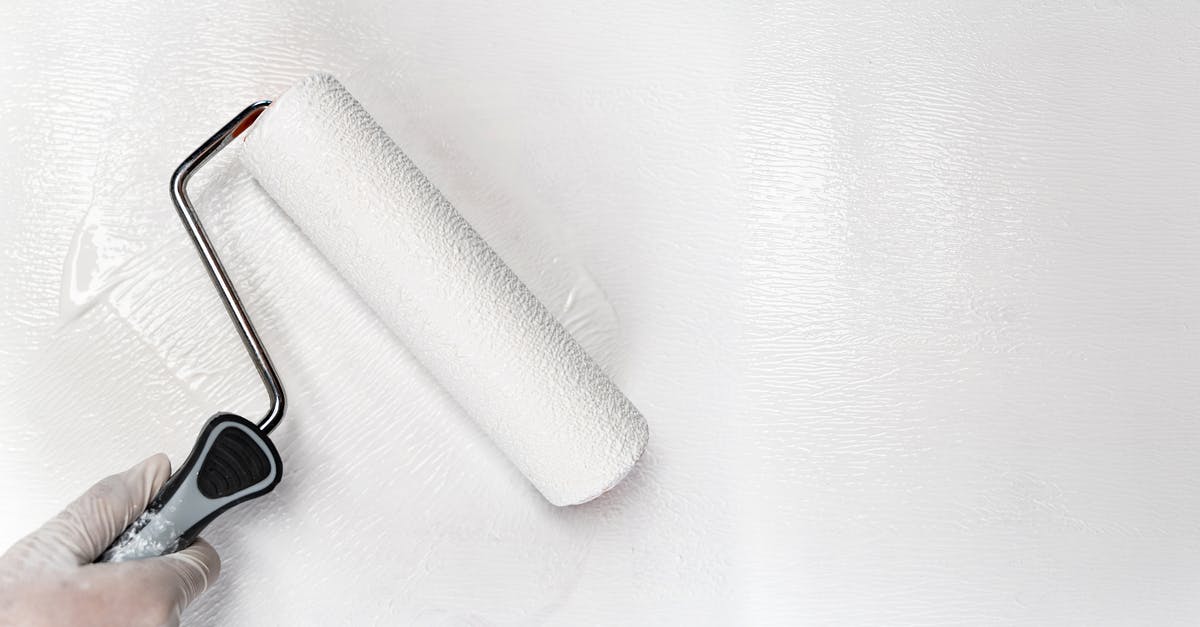 Is it possible to renew my US passport in person at a renewal facility? - Crop person painting wall with white dye using roller brush Is it possible to renew my US passport in person at a renewal facility? - Crop person painting wall with white dye using roller brush