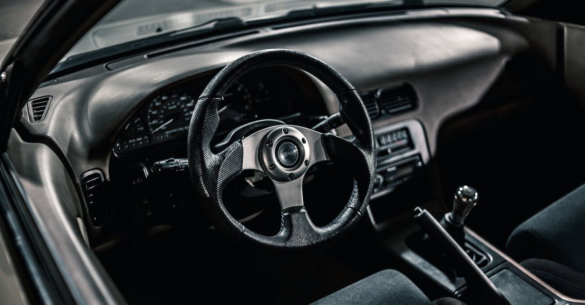 Is it possible to rent a manual transmission car in Philadelphia Intl? [duplicate] - From above of black interior of aged automobile with steering wheel and manual transmission with dashboard parked on asphalt road