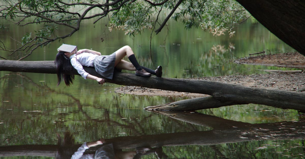 Is it possible to sleep at Podgorica airport? - Woman Lying on Tree Near Awter Is it possible to sleep at Podgorica airport? - Woman Lying on Tree Near Awter