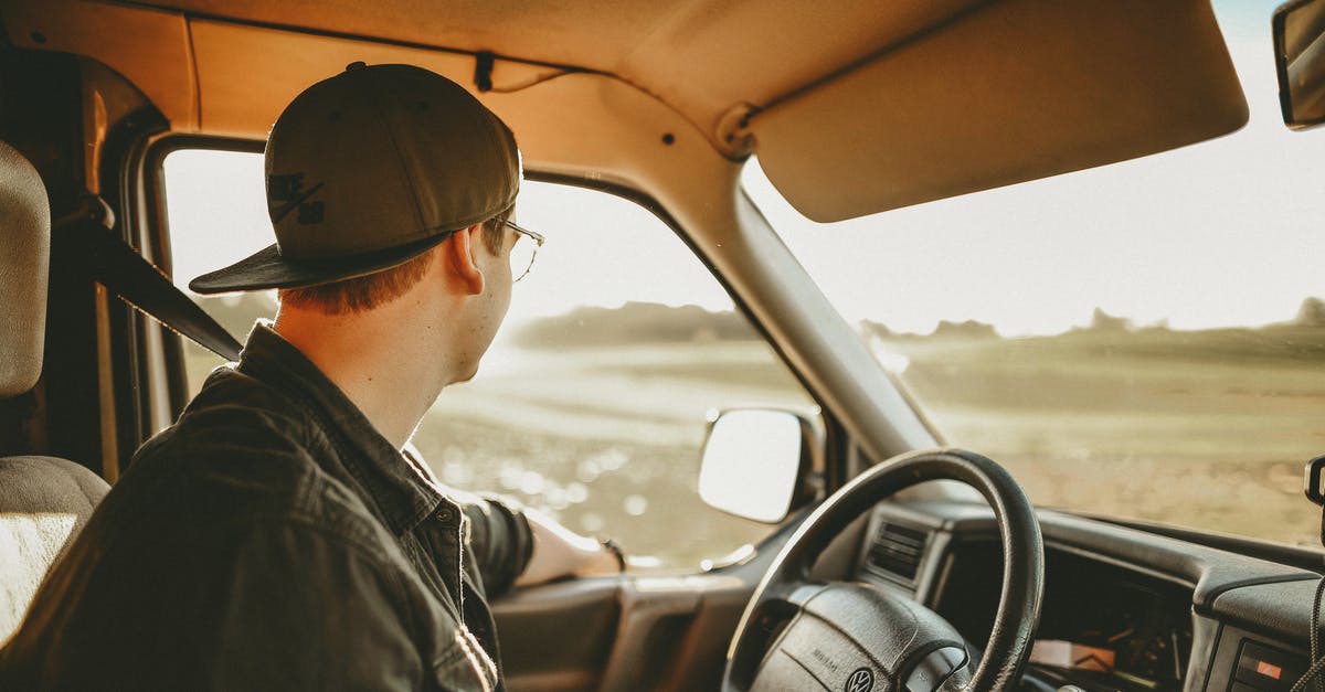 Is it possible to travel anywhere on Eurail-valid lines without reserving a seat or paying fees? [closed] - Man Wearing Black Denim Jacket in Driver's Seat