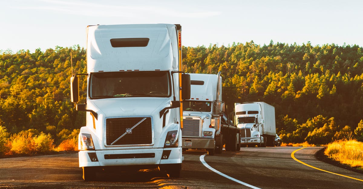Is it possible to travel on cargo airplanes? - White Volvo Semi-truck on Side of Road Is it possible to travel on cargo airplanes? - White Volvo Semi-truck on Side of Road
