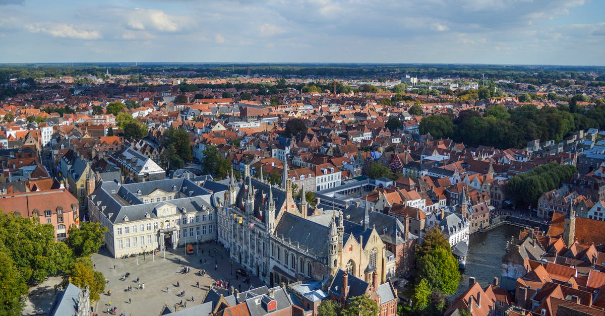 Is it possible to travel on river/canal from Bruges, Belgium to some point on the Rhine? - Canal flowing near old town square in sunlight Is it possible to travel on river/canal from Bruges, Belgium to some point on the Rhine? - Canal flowing near old town square in sunlight