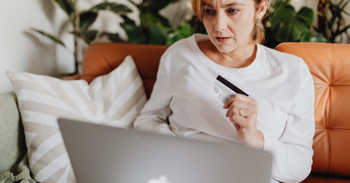 Is it possible to use a Belgian Lycamobile sim-card in Germany? - Woman Sitting on a Couch Using a Laptop and Holding a Credit Card Is it possible to use a Belgian Lycamobile sim-card in Germany? - Woman Sitting on a Couch Using a Laptop and Holding a Credit Card