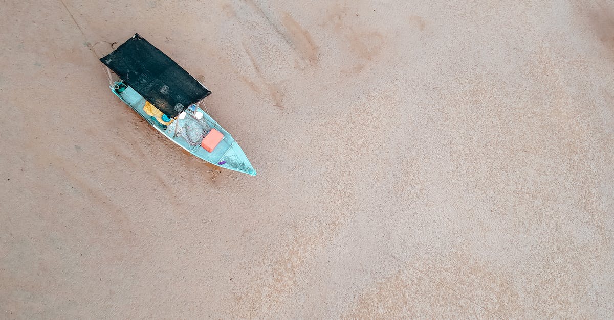 Is it possible to visit Old Goa from the beach resorts? - Old boat on empty sandy shore Is it possible to visit Old Goa from the beach resorts? - Old boat on empty sandy shore
