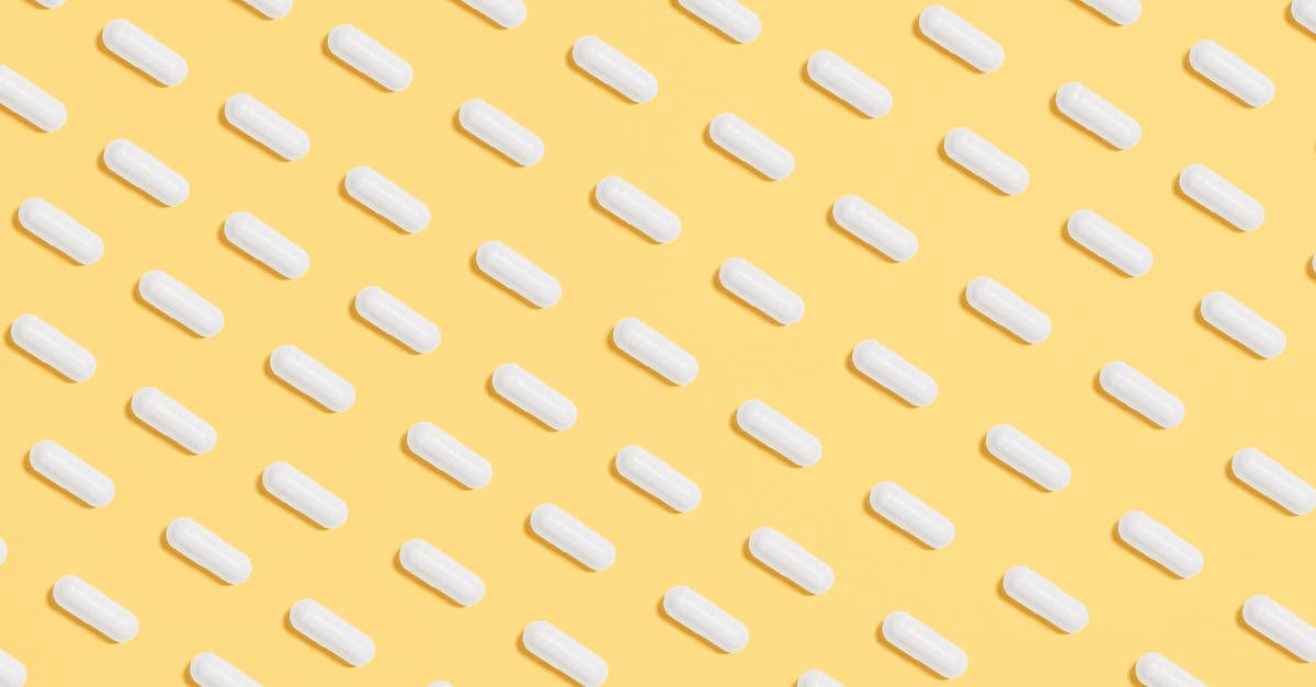 Is it safe to take prescription drugs to Hungary? - White Capsules on Yellow Background Is it safe to take prescription drugs to Hungary? - White Capsules on Yellow Background