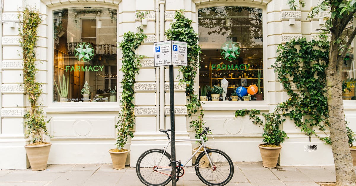 Is it safe to travel by bike between cities in Spain? - Black and White Bicycle Beside Post Is it safe to travel by bike between cities in Spain? - Black and White Bicycle Beside Post