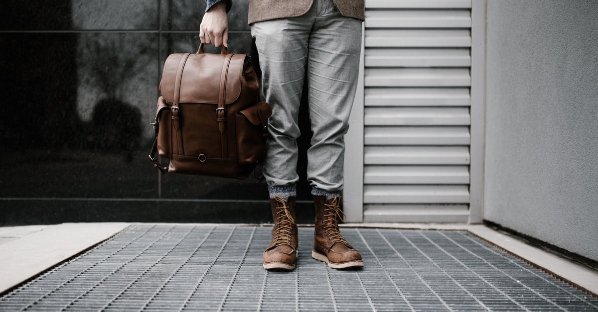 Is it safe to travel with Radio Frequency (RF) Board packed in a laptop carry-on bag - Photo of Man in Brown Blazer,Gray Pants, and Brown Boots Holding Brown Leather Bag Standing Outside Building Is it safe to travel with Radio Frequency (RF) Board packed in a laptop carry-on bag - Photo of Man in Brown Blazer,Gray Pants, and Brown Boots Holding Brown Leather Bag Standing Outside Building