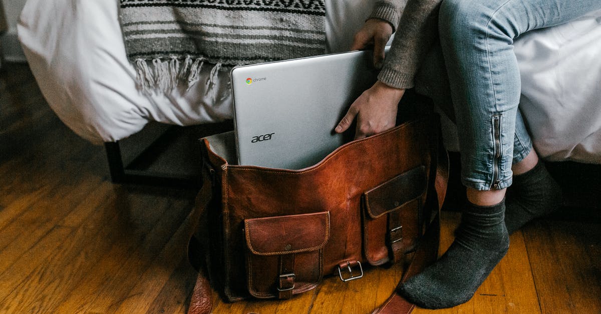 Is it safe to travel with Radio Frequency (RF) Board packed in a laptop carry-on bag - Woman in Gray Sweater Holding Silver Ipad Is it safe to travel with Radio Frequency (RF) Board packed in a laptop carry-on bag - Woman in Gray Sweater Holding Silver Ipad