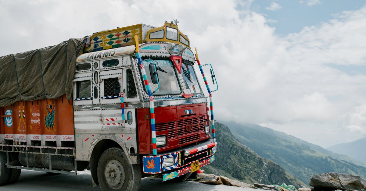 Is it safer to drive up or down a dangerous mountain road? - Aged truck driving in mountainous valley in sunlight Is it safer to drive up or down a dangerous mountain road? - Aged truck driving in mountainous valley in sunlight