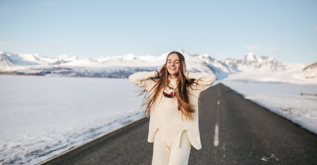 Is it sensible to go around Iceland in winter in a single week (Saturday to Saturday)? [closed] - A Stylish Woman Posing on the Road