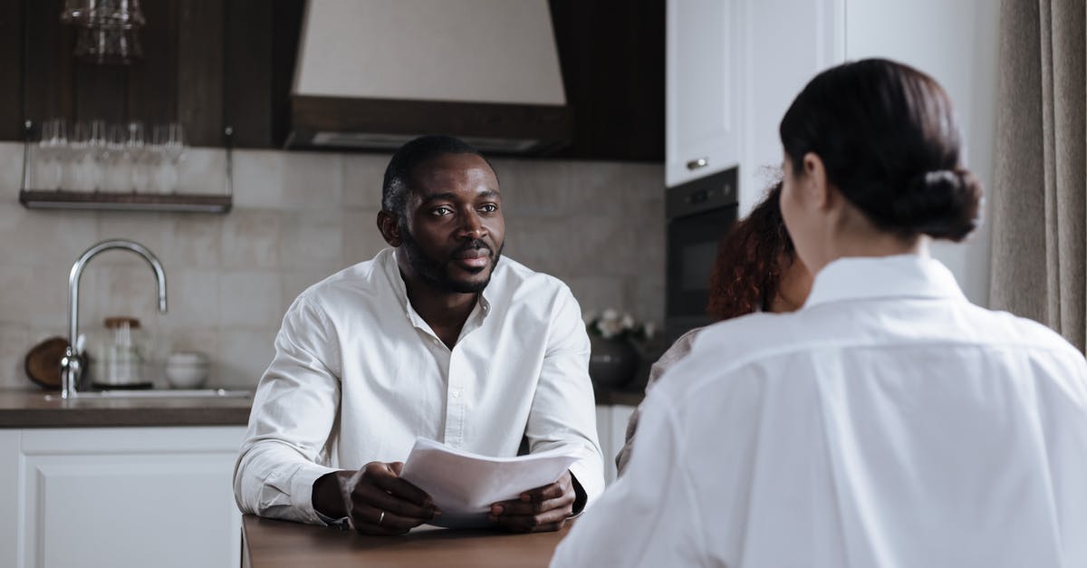 Is it the carrier's responsibility to bringing a passenger home? - Afro-American Man and Caucasian Woman Having Meeting at Home with Social Worker Is it the carrier's responsibility to bringing a passenger home? - Afro-American Man and Caucasian Woman Having Meeting at Home with Social Worker