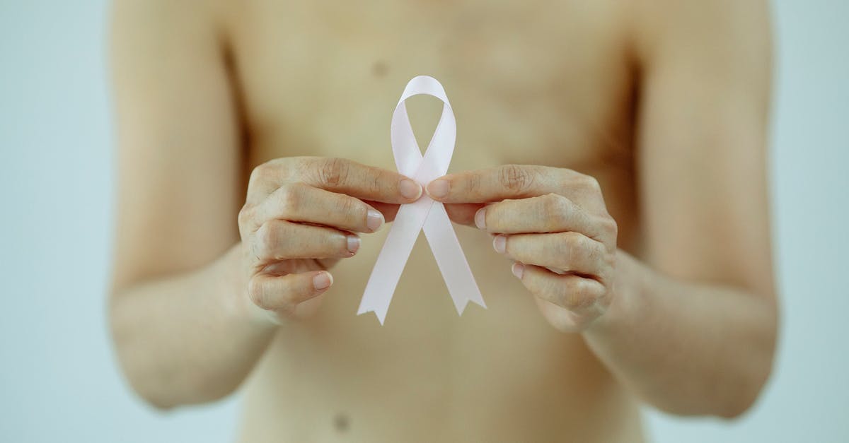 Is it true that a "dekoriert"-sign means that naked women are dancing? - Crop shirtless woman showing pink ribbon Is it true that a "dekoriert"-sign means that naked women are dancing? - Crop shirtless woman showing pink ribbon