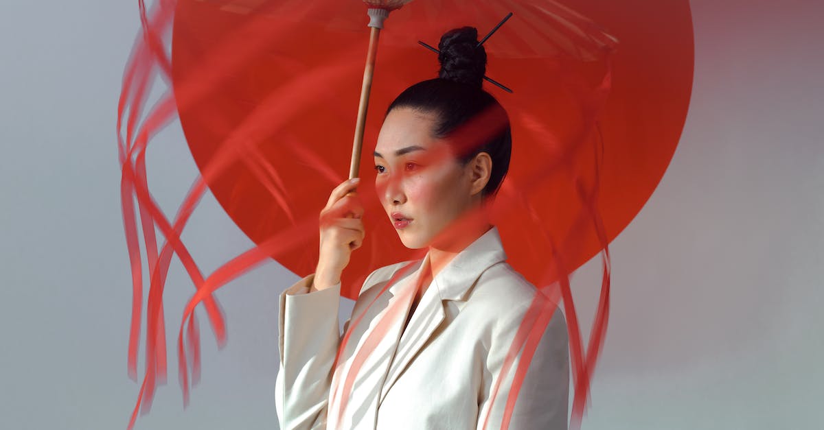Is it usual for Japanese sentos to offer cheap overnight stays like their Korean counterparts (jjimjilbangs) do? - Woman in White Blazer Holding Red Umbrella Is it usual for Japanese sentos to offer cheap overnight stays like their Korean counterparts (jjimjilbangs) do? - Woman in White Blazer Holding Red Umbrella
