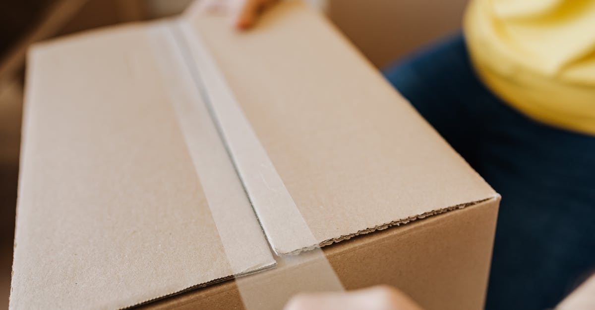 Is liability insurance required in order to rent a car? - Crop man sealing cardboard box with tape Is liability insurance required in order to rent a car? - Crop man sealing cardboard box with tape