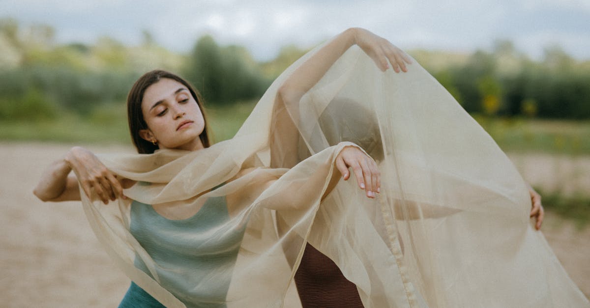 Is long-term renting through booking.com a scam? - Women dancing outdoors covered in see-through fabric