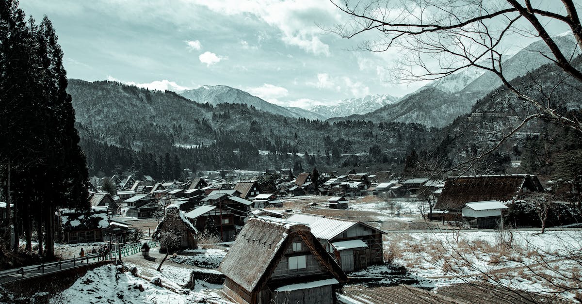 Is Mount Pilatus worth visiting in winter? - Village with houses near mountains in winter under cloudy sky Is Mount Pilatus worth visiting in winter? - Village with houses near mountains in winter under cloudy sky