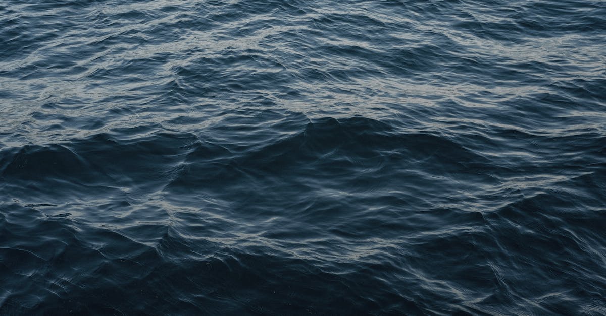 Is mozzarella liquid affected by the no fluids policy on planes? - From above of wavy dark blue ocean with ripples on surface in daytime Is mozzarella liquid affected by the no fluids policy on planes? - From above of wavy dark blue ocean with ripples on surface in daytime