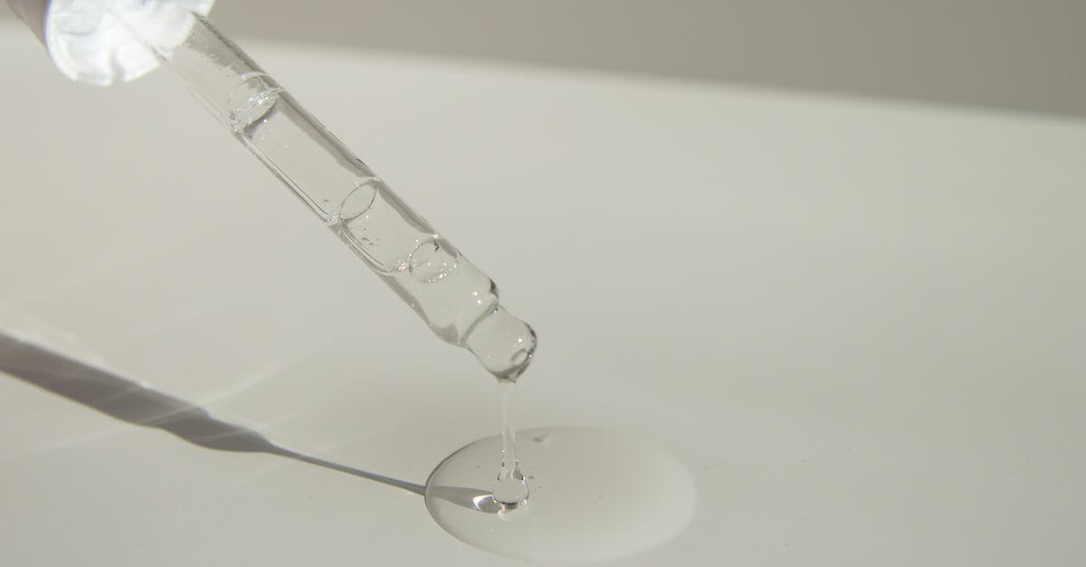 Is mozzarella liquid affected by the no fluids policy on planes? - Anonymous person pouring liquid product on table with pipette Is mozzarella liquid affected by the no fluids policy on planes? - Anonymous person pouring liquid product on table with pipette