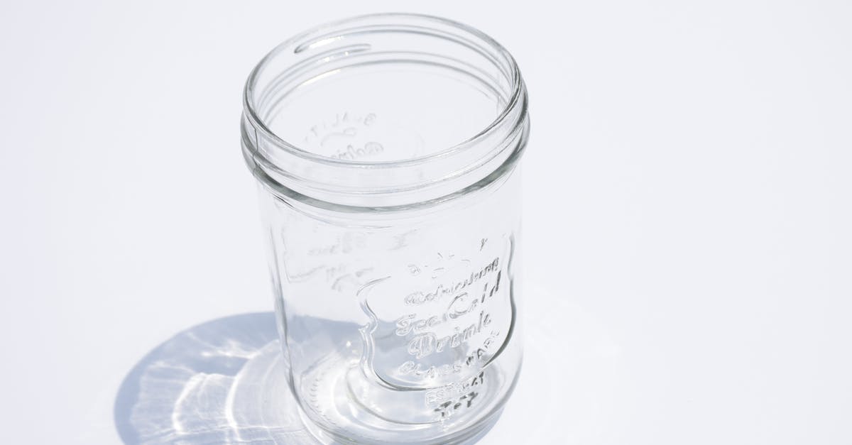Is okay to bring an empty mason jar in your carry on? [closed] - Close-Up Photo of an Empty Glass Jar on a White Surface