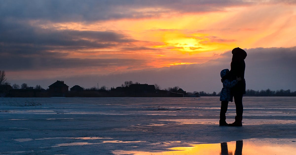 Is river travel to Vientiane and Phnom Penh recommended? - Child and Woman Standing Near Water Is river travel to Vientiane and Phnom Penh recommended? - Child and Woman Standing Near Water